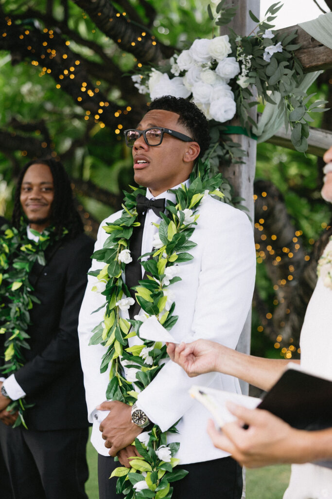 groom emotional watching the bride walk down the aisle