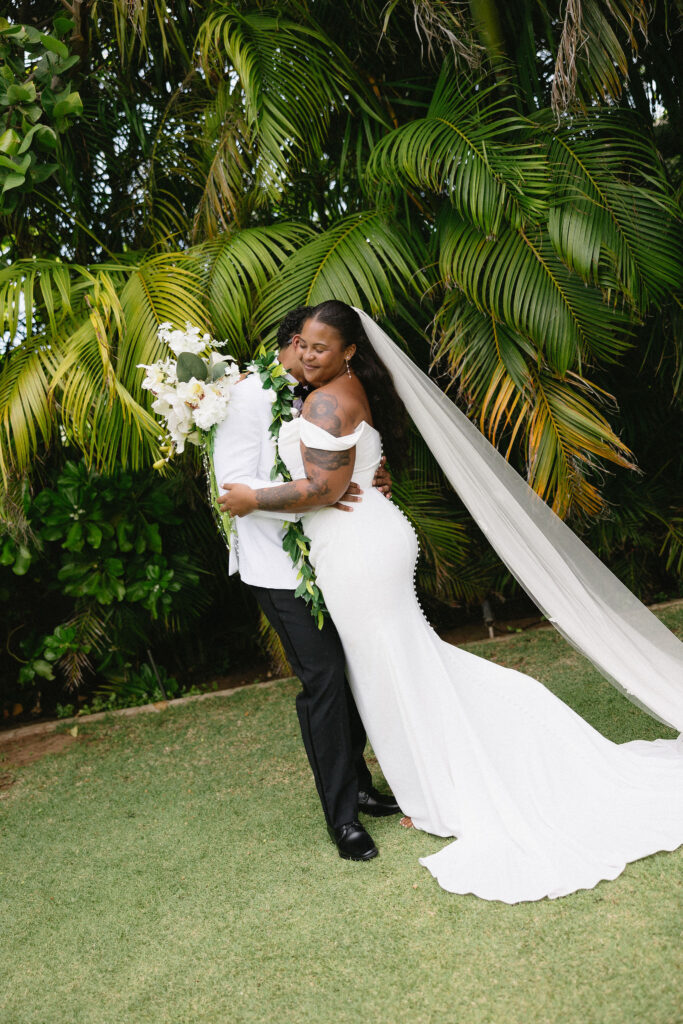 groom kissing the bride on the cheek