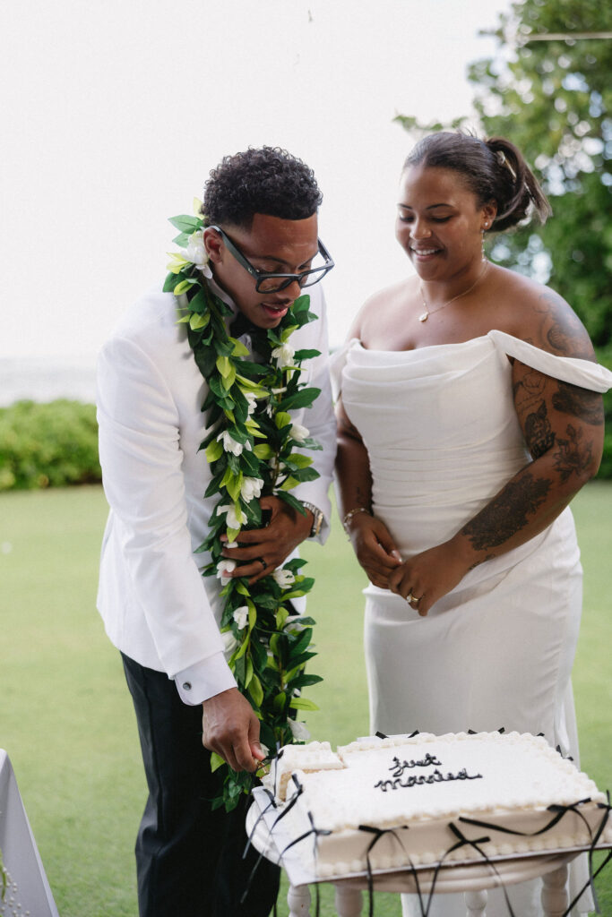 newlyweds cutting their wedding cake